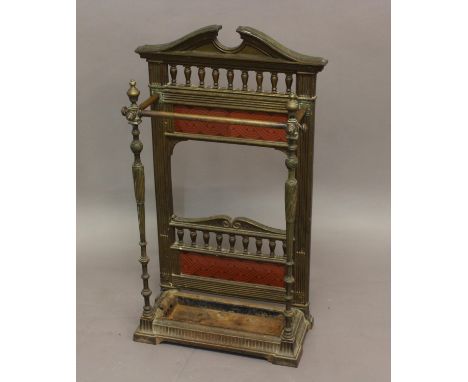 VICTORIAN BRASS &amp; CAST IRON STICK STAND a cast iron and brass stick stand with brass rail, with glazed tiles to the back 