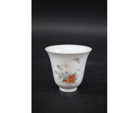 CHINESE FAMILLE VERTE CUP Kangxi marks but late Qing Dynasty, the small cup painted with flowers and insects amongst rocky ou