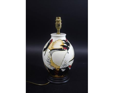 MOORCROFT LAMP in the Cranes of Kashmir design and with a wooden base, designed by Emma Bossons. With a shade and attachment,