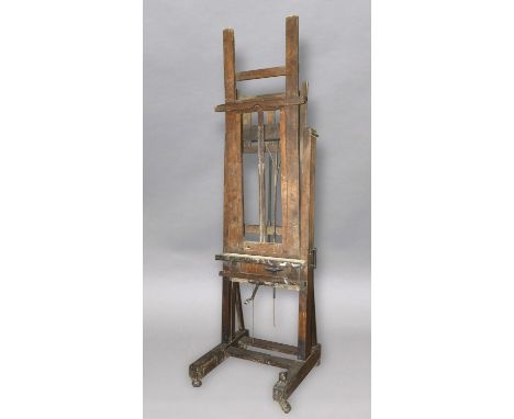 A LARGE WINSOR AND NEWTON 'IMPROVED STUDIO EASEL', with single shelf and adjustable height and tilt, supported on an H-frame 