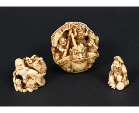 LARGE JAPANESE CARVED IVORY NETSUKE - SIGNED Meiji period, carved in the form of a warship with figurehead, and with various 