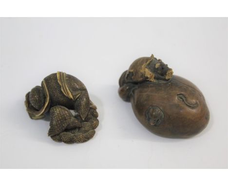 JAPANESE IVORY NETSUKE of a quail and chick eating millet, signed to the base (chips underneath, 4cms long), also with a carv