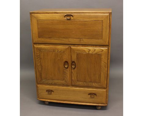 ERCOL SERVING CABINET Model No 430, a light elm bureau/cabinet with a drop down flap, with a central two door cupboard and dr