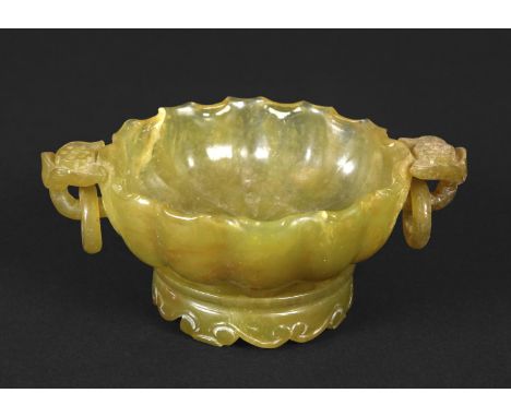 CHINESE CARVED DISH &amp; STAND possibly soapstone or agate, a two handled fluted green and brown flecked dish, each handle w