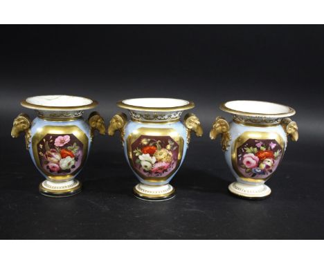 SET OF THREE 19THC PORCELAIN VASES a set of three vases, each with a panel brightly painted with a variety of flowers against