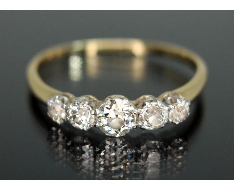 An early 20th century five stone diamond ring, the Old European cut stones weighing approx. 0.09, 0.20, 0.37, 0.18 &amp; 0.12