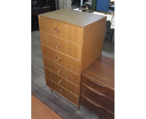 A Meredew tall light oak chest of drawers, height 124cm.  