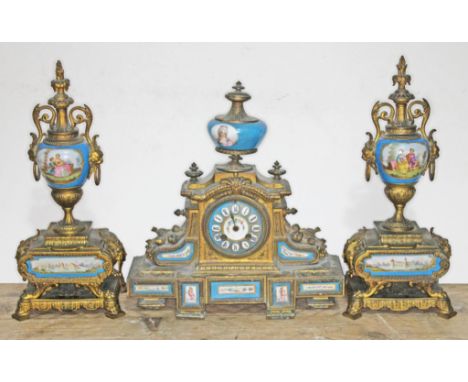 A late 19th century gilt metal and porcelain clock garniture, height 39cm. Condition - as found, porcelain intacked.