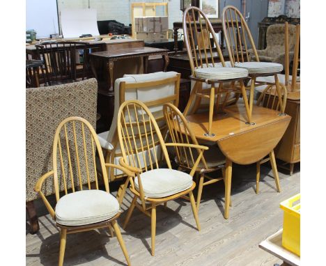 An Ercol Blonde elm and beech drop leaf table and six chairs.Condition - general good, table with signs of use, marks and lig