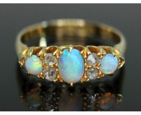 A late Victorian opal and diamond ring, the cluster measuring approx. 17.21mm x 7.06mm, hallmarked 18ct gold band, sponsor's 