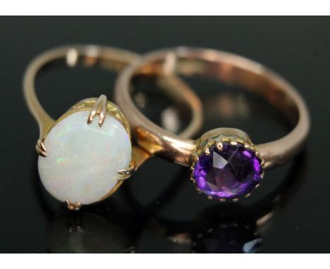 An early 20th century precious opal ring and an amethyst set ring, both marked '9ct', gross weight 3.81g, size M &amp; O resp