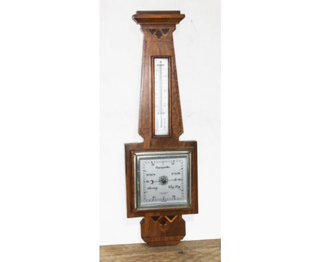 An Art Deco inlaid walnut aneroid barometer, signed Clarke &amp; Ainsworth Blackpool, length 57cm.  