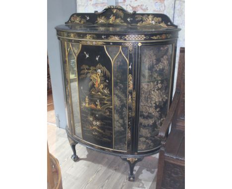 An early 20th century bow front Chinoiserie decorated display cabinet, width 115cm, depth 41cm &amp; height 151cm.  