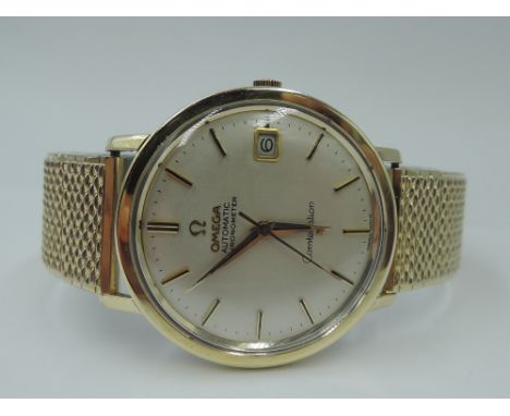 A gent's gold plated Omega Constellation automatic chronometer wrist watch having baton numeral dial with date aperture to ch