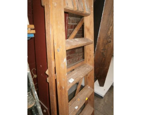 pair of wooden step ladders