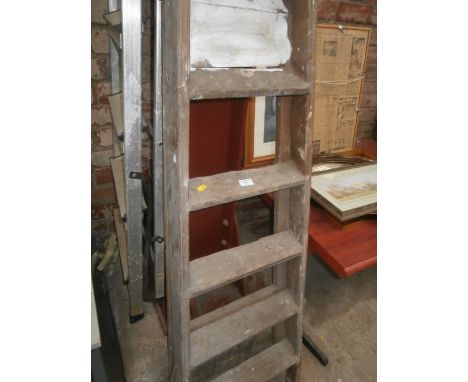pair of wooden step ladders