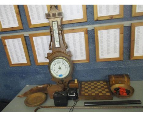 Treen to include an Art Nouveau oak and barometer, a chess board/backgammon with draught pieces, a walking stick and other it