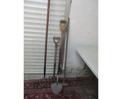A group of four wooden handled garden tools to include a Vaughan Bros, Birmingham spade 