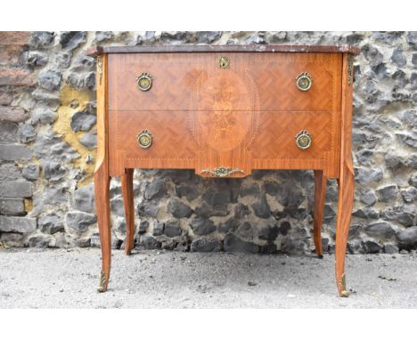 A late 20th century Louis XV style marquetry and parquetry commode with a mottled brown marble top, over two drawers, on cabr