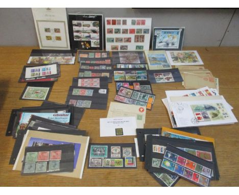 Stamps on stock cards (Commonwealth &amp; All World) (65) items with Older Pre-Paid Postcards and modern maximum cards (27). 