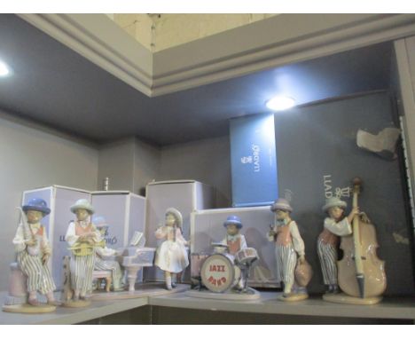 A Lladro porcelain Jazz Band to include a Jazz Saxophonist and Jazz Horn, all boxed 