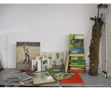 A golf bag containing vintage golf clubs to include Meteors, together with vintage golf books, two of which are signed, to in