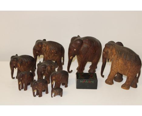 A herd of vintage wooden elephants, and wooden box &amp; contents (sold as seen) 