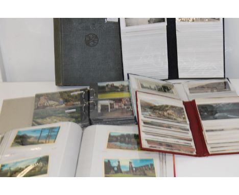 A selection of full postcard albums  and one empty vintage album 