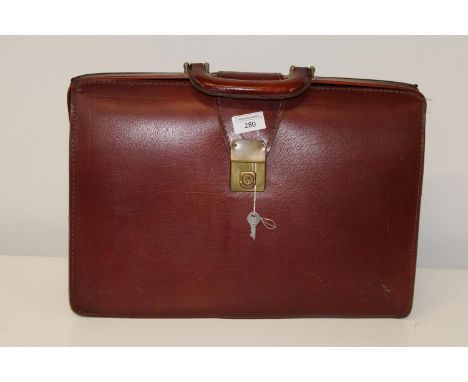 A vintage brown leather attache case 