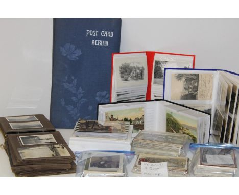 A large collection of vintage postcards and one empty vintage album 