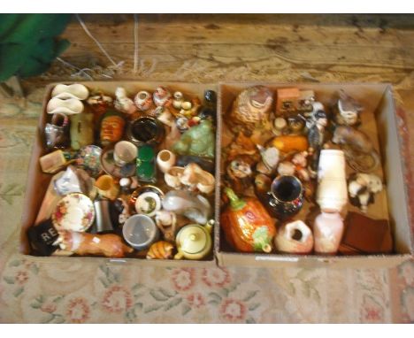 Two boxes of decorative items, including Continental and other ceramic figures, a simulated jade Buddha, wall masks and other