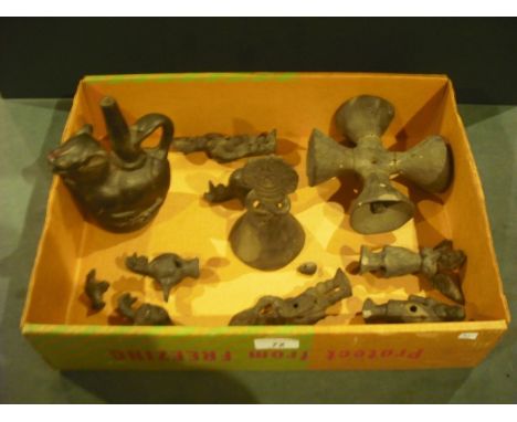 A collection of eleven early/mid-20th century Mexican Oaxaca ceramic figures, variously modelled as angels, deities, a loop h