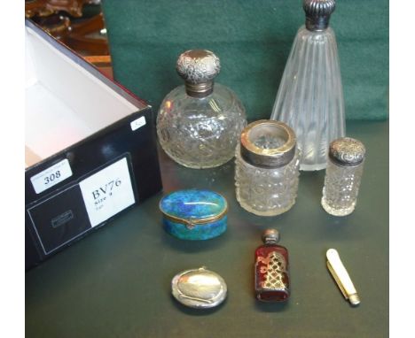 Four silver mounted dressing table bottles/jars, together with a cranberry and white metal overlaid scent bottle, a mother of