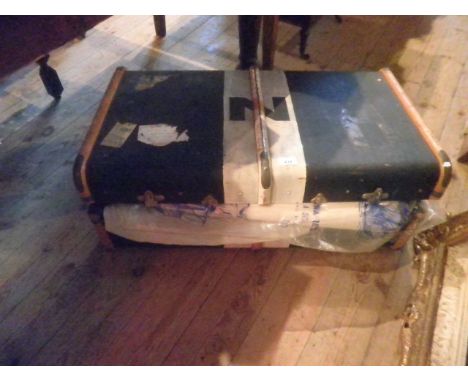 An early 20th century canvas wooden bound cabin trunk.