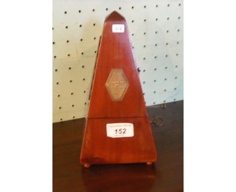 A mid-20th century mahogany cased metronome.   