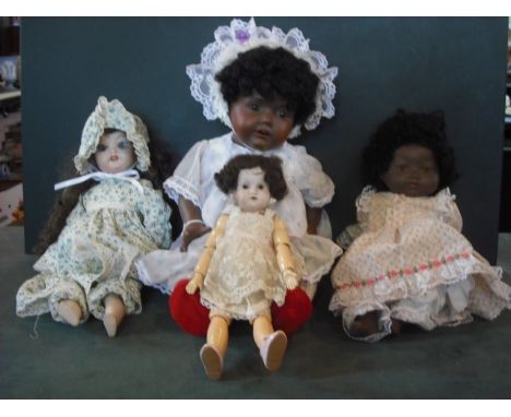 An Armand Marseille bisque black doll, head mould number 351, together with a Hilda bisque black doll, number 245, a Simon Ha