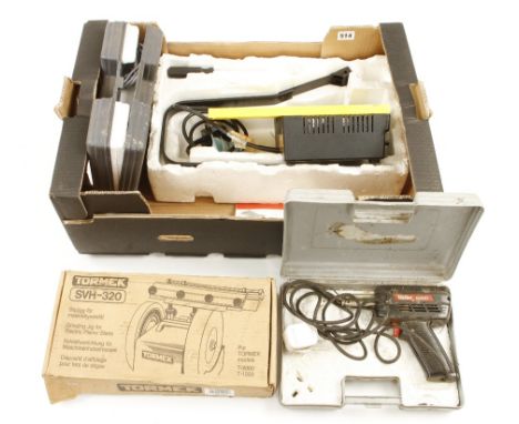 A scroll saw, two soldering irons and a grinder attachment G