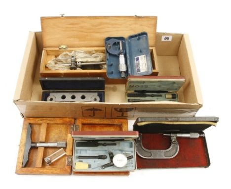 Two micrometers, a scribing block and 4 other tools 