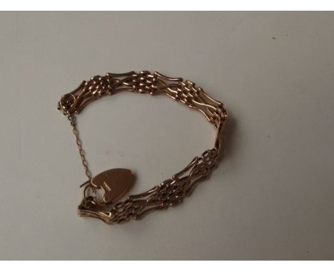 9 carat gold gate bracelet with heart shaped lock and safety chain, weight 13 grams