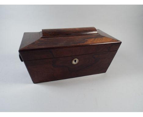 A George IV Rosewood Tea Caddy of Sarcophagus Form. The Hinged Lid to Interior with Centre Compartment Flanked by Two Lidded 