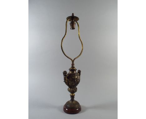 A Late 19th Century French Cast Metal Table Lamp with Rococo Cherub Decoration Supported on a Rouge Marble Base. 48cm High