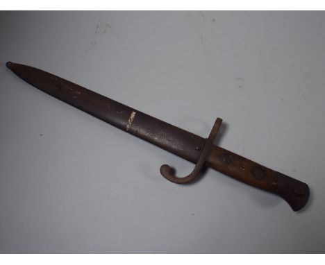 A Wooden Handled Bayonet in Metal Scabbard. 