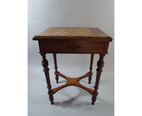 A Victorian Inlaid Walnut Lift and Twist Games Table with Chequer Top, Baize Interior and Cribbage Scorer. Centre Drawer, Tur