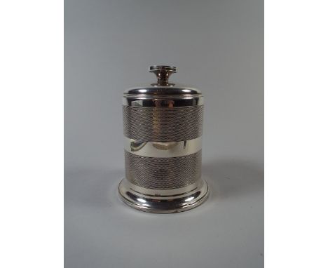 A Silver Cylindrical Table Top Cigarette Box or Dispenser. With Engine Turned Decoration. Birmingham 1948. 12cm High