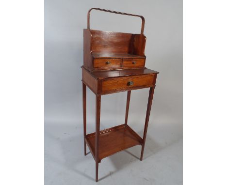 An Edwardian Ladies Side Table with Single Drawer and Stretcher Shelf. Detachable Book Trough with Two Small Drawers.