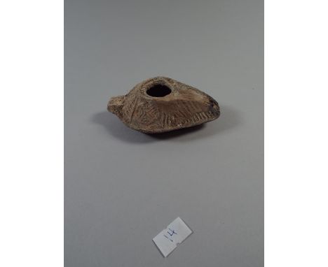 A Small Roman Oil Lamp Dating from the Second Century AD and Found In Palestine. 