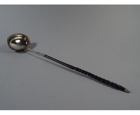 A Georgian Silver Ladle with Twisted Horn Handle. Monogrammed W M A. Hallmarked for London. Date Mark Rubbed.  34cm Long