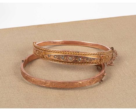 An Edwardian 9ct gold hinged bangle, Chester 1910, set with seven graduated diamonds and another 9ct gold hinged bangle, appr