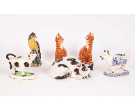 A pair of Griselda Hill Wemyss pottery cats, 17.5cm high, two cow creamers, etc.