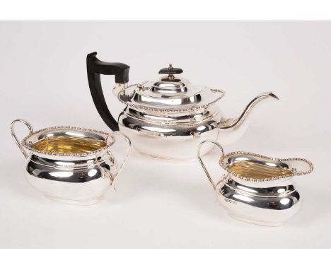 A three-piece silver tea set, Viner's Ltd, Sheffield 1928, comprising a teapot, a two-handled sugar bowl and a milk jug, with